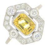 A yellow sapphire and diamond dress ring.Total sapphire weight 1.50cts.