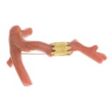 A coral branch brooch.Length 7cms.