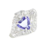 A tanzanite and diamond dress ring.Tanzanite calculated weight 0.81ct,