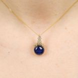 A circular sapphire cabochon and brilliant-cut diamond pendant,