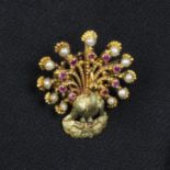 A ruby and split pearl peacock brooch.Length 3.5cms.