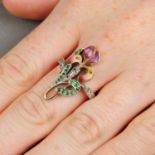 An Art Nouveau gold and silver, emerald, rose-cut diamond and enamel iris floral ring.