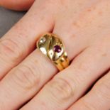 An early 20th century 18ct gold ruby and old-cut diamond snake ring.