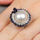 A mid 20th century gold mabe pearl, diamond and sapphire dress ring.