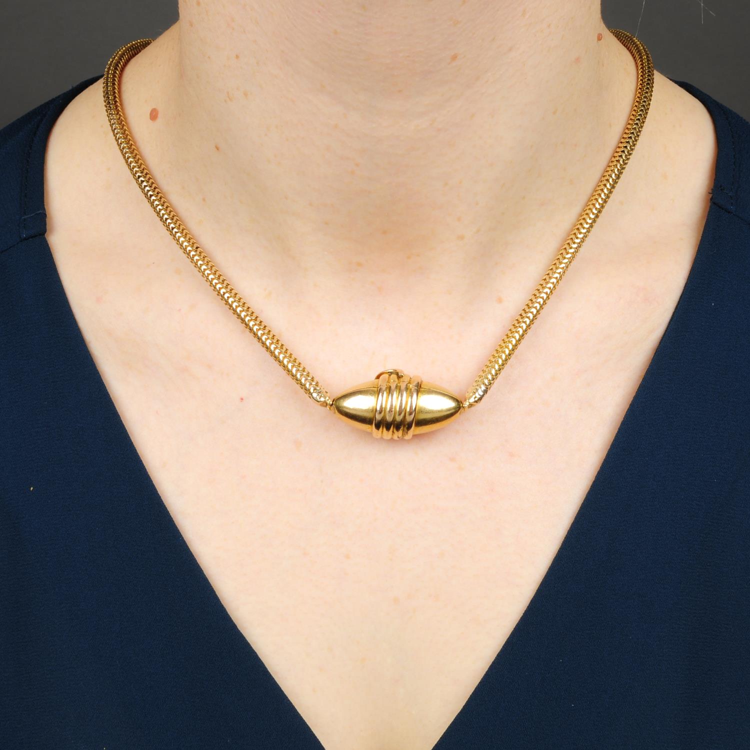 A late Victorian gold ruby-eyed snake locket necklace.Length 38.5cms. - Image 3 of 5