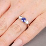 A sapphire and brilliant-cut diamond three-stone ring.Sapphire weight 1.05cts.Estimated total