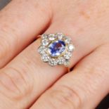 A sapphire and diamond cluster ring.Sapphire calculated weight 1.14cts,