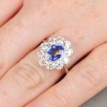 A sapphire and diamond cluster ring.Sapphire calculated weight 1.46cts,
