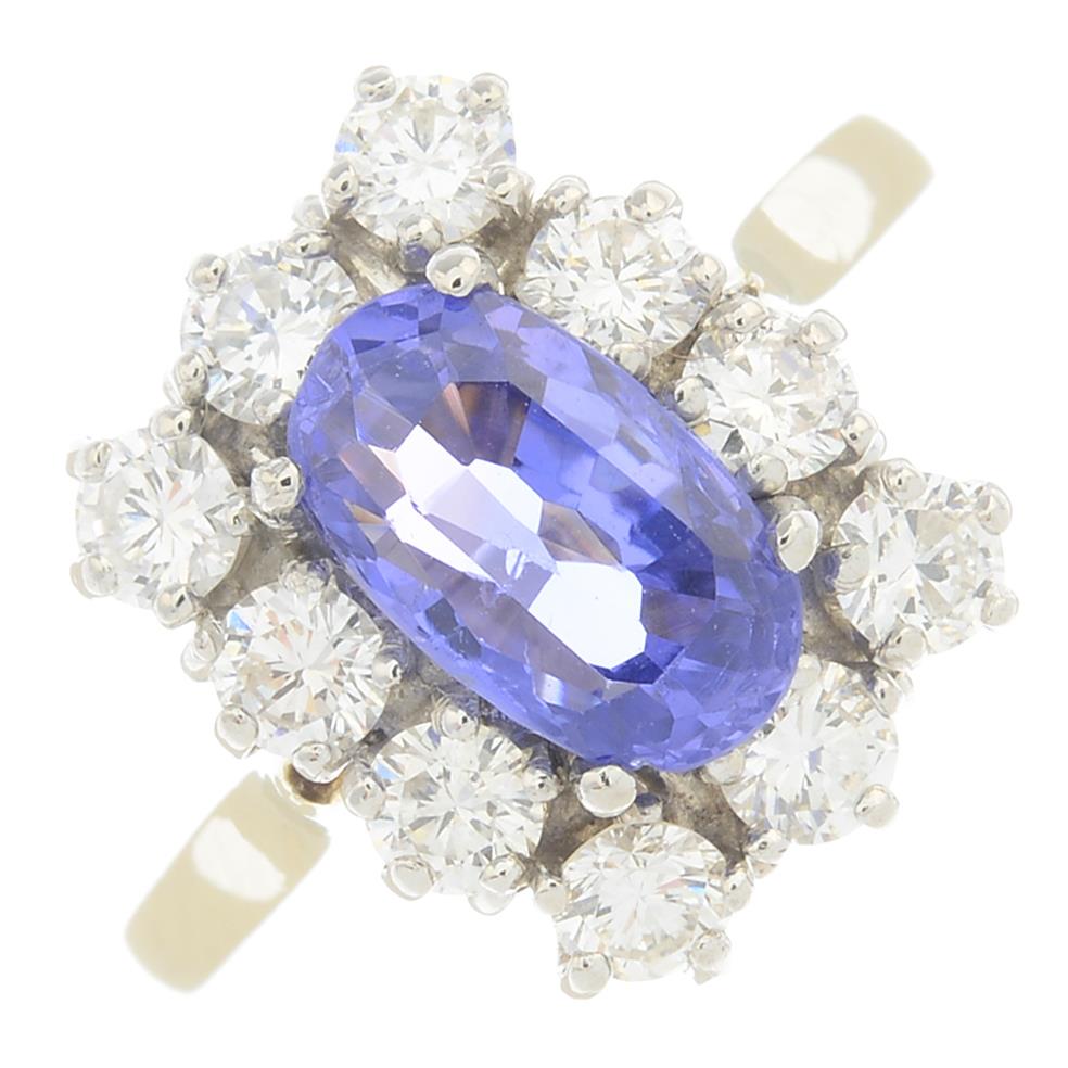 A sapphire and diamond cluster ring. - Image 6 of 6