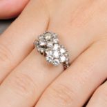 A brilliant-cut diamond cluster crossover ring.Estimated total diamond weight 2.50cts,