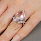 A fancy-cut morganite and brilliant-cut diamond dress ring.Morganite estimated dimensions 18.5 by