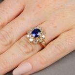 An early 20th century gold Burmese sapphire and diamond cluster ring.