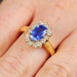 A sapphire and brilliant-cut diamond cluster ring.Sapphire calculated weight 1.98cts,