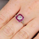 A brilliant-cut diamond and calibre-cut ruby cluster ring.