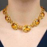 A graduated oval-shape citrine necklace,