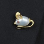 An 18ct gold, baroque cultured pearl mouse brooch, with ruby eyes and diamond accent ears, by E.