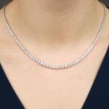 A graduated brilliant-cut diamond line necklace.