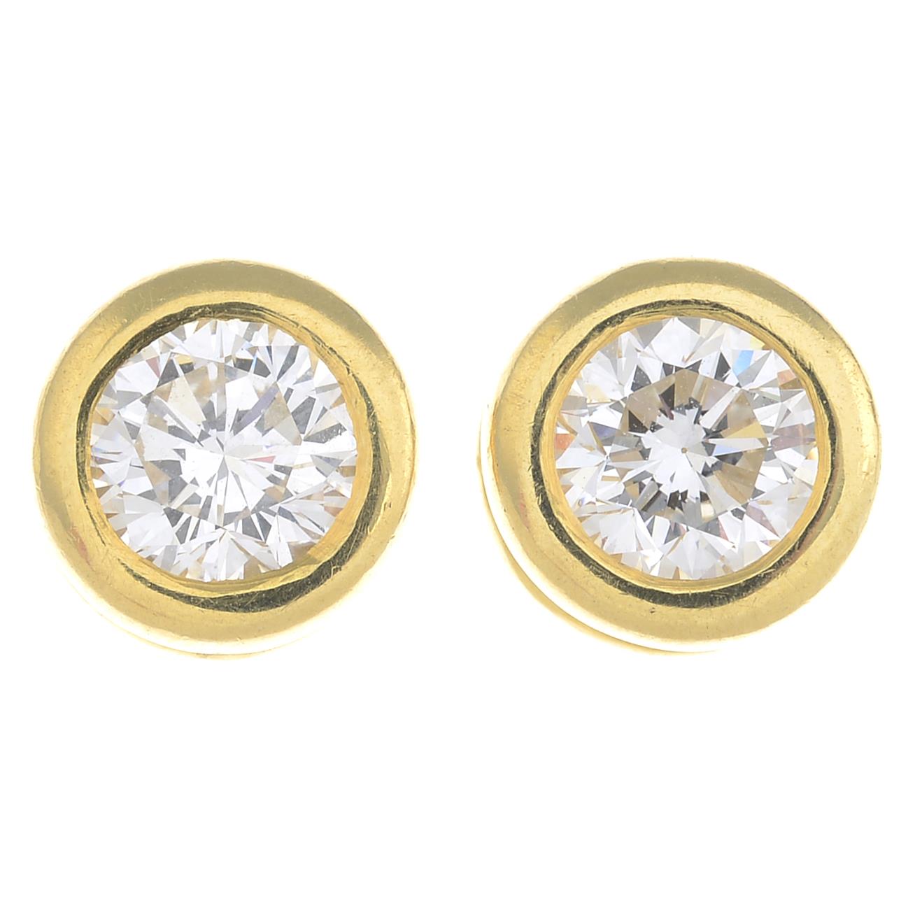 A pair of 18ct gold brilliant-cut diamond collet stud earrings. - Image 3 of 3