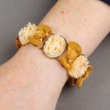 A mid to late 19th century bracelet, the Cantonese carved ivory panels, with filigree bow spacers.