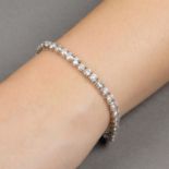 An 18ct gold brilliant-cut diamond line bracelet.