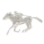 An 18ct gold diamond horse and jockey brooch.Engraved 1/100,