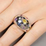 An 18ct gold diamond and gem-set bombe ring.Estimated total diamond weight 0.15ct.