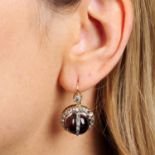 A pair of garnet cabochon and rose-cut diamond earrings.