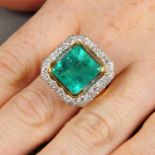 A Colombian emerald and pave-set diamond cluster ring.