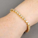 An 18ct gold brilliant-cut diamond line bracelet.