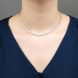 A graduated brilliant-cut diamond line necklace.Estimated total diamond weight 8.50 to 9cts,