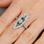 A vari-cut diamond and emerald geometric cluster ring.Estimated total diamond weight 1.15cts,