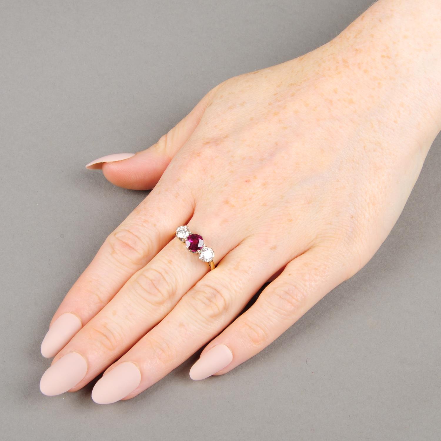 An 18ct gold Thai ruby and brilliant-cut diamond three-stone ring.With report 79215-54, - Image 3 of 6