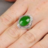 A natural jadeite cabochon and circular-cut diamond cluster ring.Verbal from GCS,