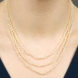 A natural pearl and seed pearl three-strand necklace,