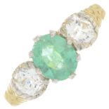 An emerald and circular-cut diamond three-stone ring.Emerald weight 0.79ct.Estimated total diamond
