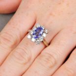 A sapphire and diamond cluster ring.