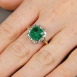 A Colombian emerald and old-cut diamond cluster ring.