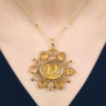 A citrine and seed pearl pendant with central cherub scene and seed pearl chain.