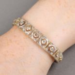 An early 20th century old and rose-cut diamond graduated panel bracelet.