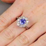 An early 20th century sapphire and old-cut diamond cluster ring.