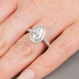 A platinum pear-shape and brilliant-cut diamond cluster ring.