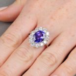 An oval-shape tanzanite and brilliant-cut diamond cluster ring.Tanzanite calculated weight 4.15cts,