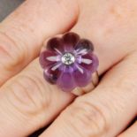 A brilliant-cut diamond and carved amethyst ring.Estimated dimensions of amethyst 18.9 by 18.8mms.