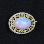 A Belle Epoque gold and platinum, opal, demantoid garnet and rose-cut diamond brooch.