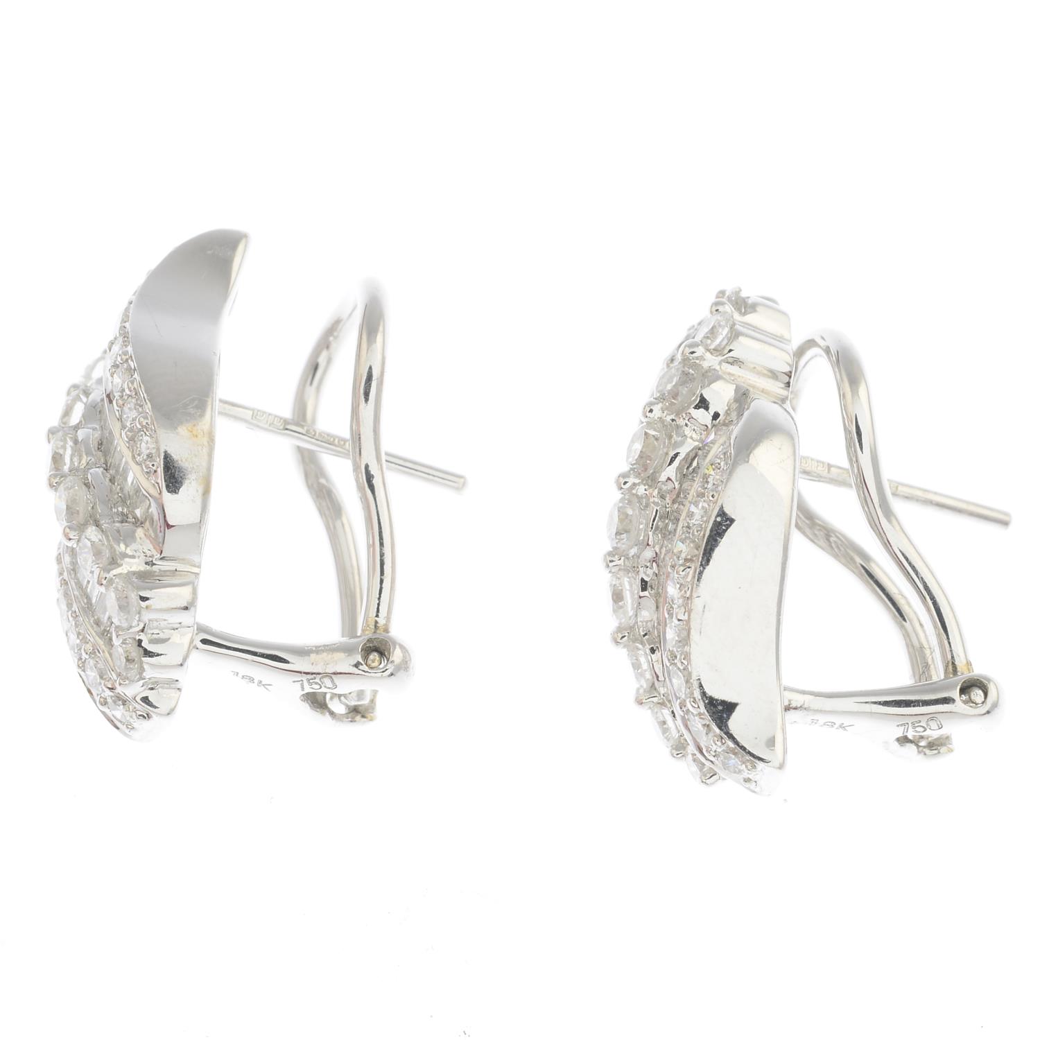 A pair of 18ct gold diamond scroll earrings. - Image 2 of 2