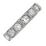 A mid 20th century platinum diamond full eternity ring.