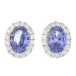 A pair of sapphire and diamond earrings.Total sapphire weight 1.95cts,