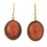 A pair of garnet cabochon single-stone earrings.Length 2.3cms.