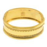 A late Victorian gold hinged bangle.