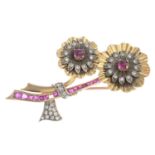 A mid 20th century ruby and diamond flower brooch.